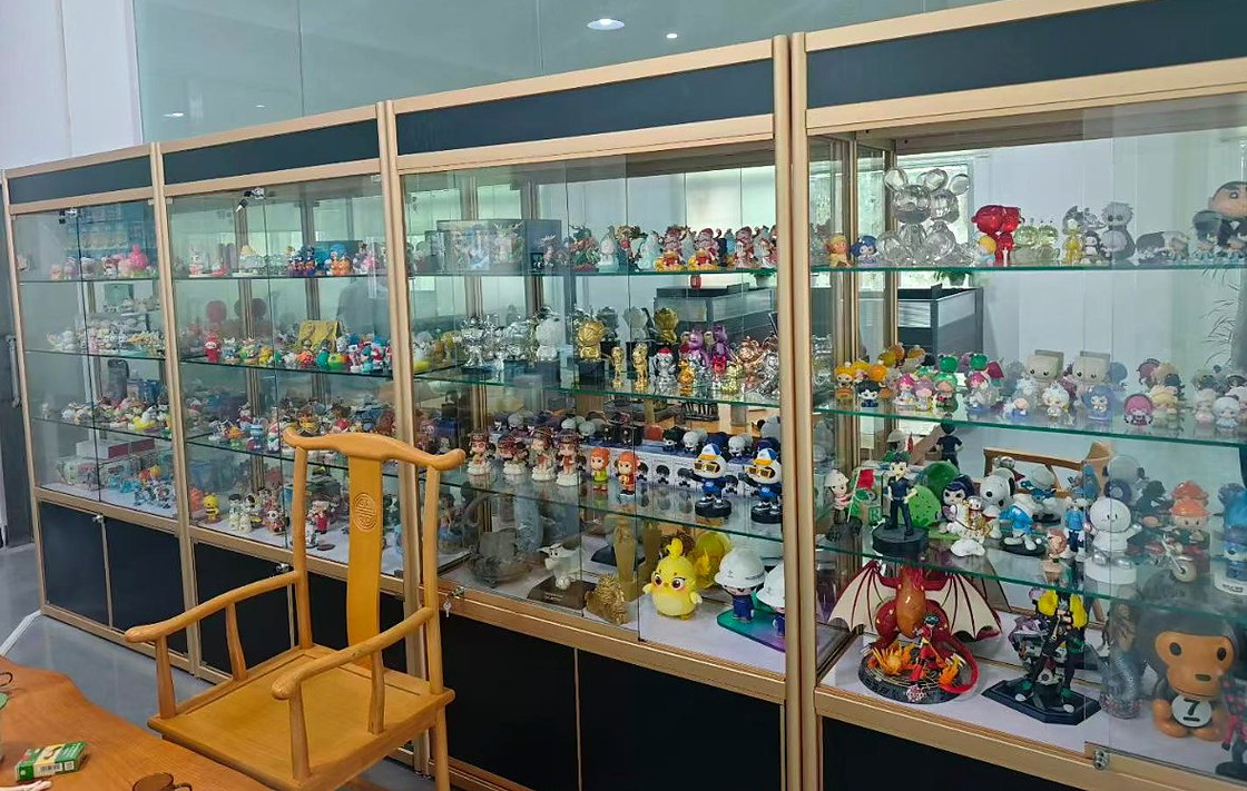 WINTEL showroom display cabinets filled with custom PVC and silicone promotional figurines in Shenzhen