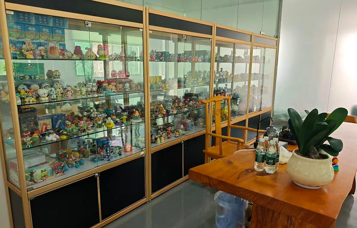 WINTEL showroom with custom promotional gift sample cabinets and a meeting table